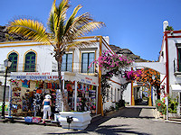 The marina in Puerto de Mogan is littered with bougainvillea-draped shops and streets. 