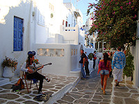 Strolling along the streets of Mykonos town is a favorite pastime for tourists and locals alike.
