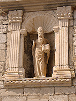 Saint Blaise, the patron saint of Dubrovnik, is often depicted holding a model of the city.  According to legend, the saint appeared to the rector to warn him of an impending Arab attack on the city.