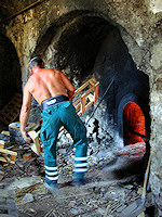 A sturdy Turkish gentleman stokes the fires that heat the water beneath the hamam.