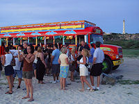 The Kukoo Kunuku bus stops near the California lighthouse for a sunset champagne toast.